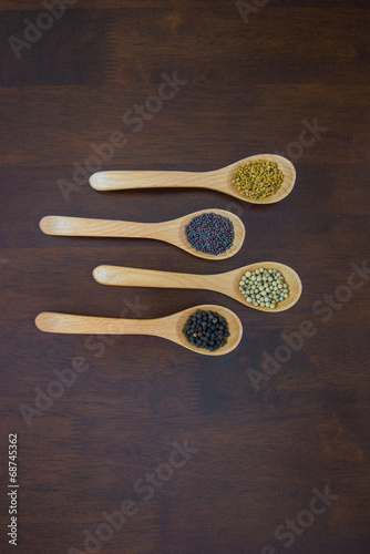 Spices in wooden spoons