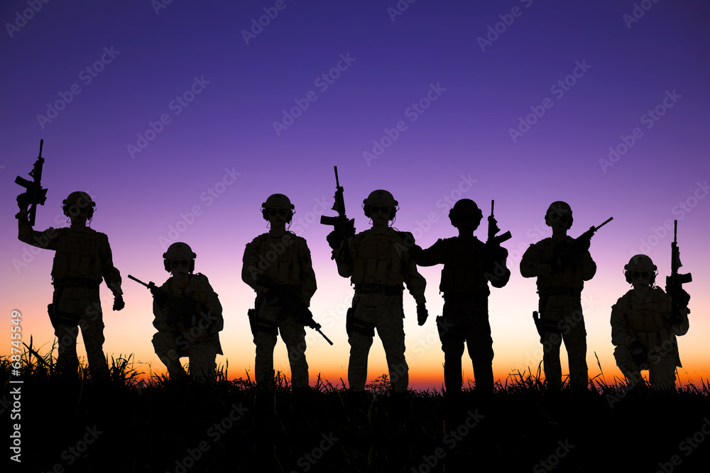 silhouette of Soldiers team with sunrise background silhouette of Soldiers team with sunrise background