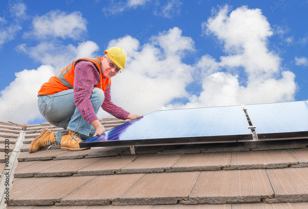 worker and solar panels worker and solar panels