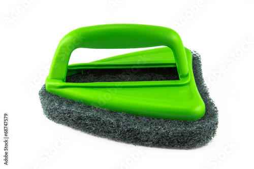 Green sponge brush on white background