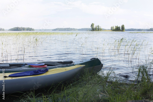 Two kayaks on the bank of the Vuoksa lake.