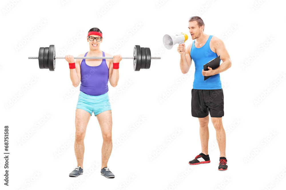Fitness coach shouting at a guy through megaphone Fitness coach shouting at a guy through megaphone