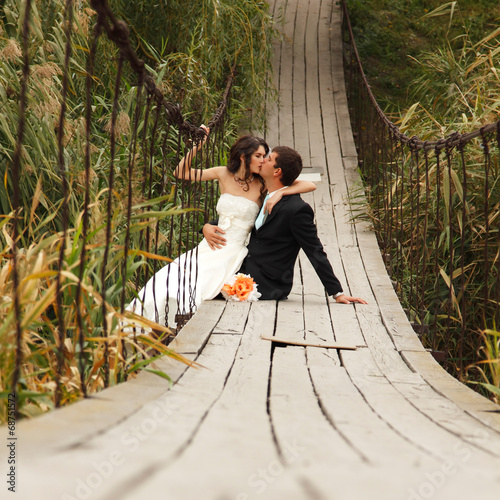 young wedding couple, beautiful bride with goom, summer nature o photo