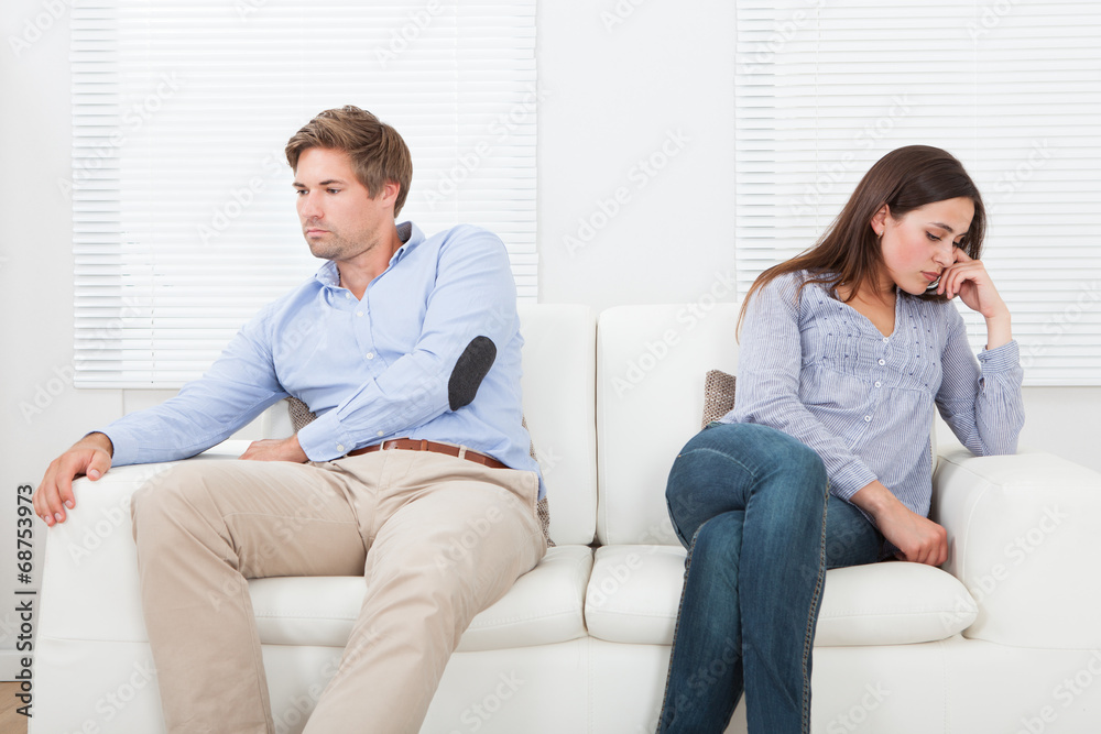 Couple Ignoring Each Other On Sofa Couple Ignoring Each Other On Sofa