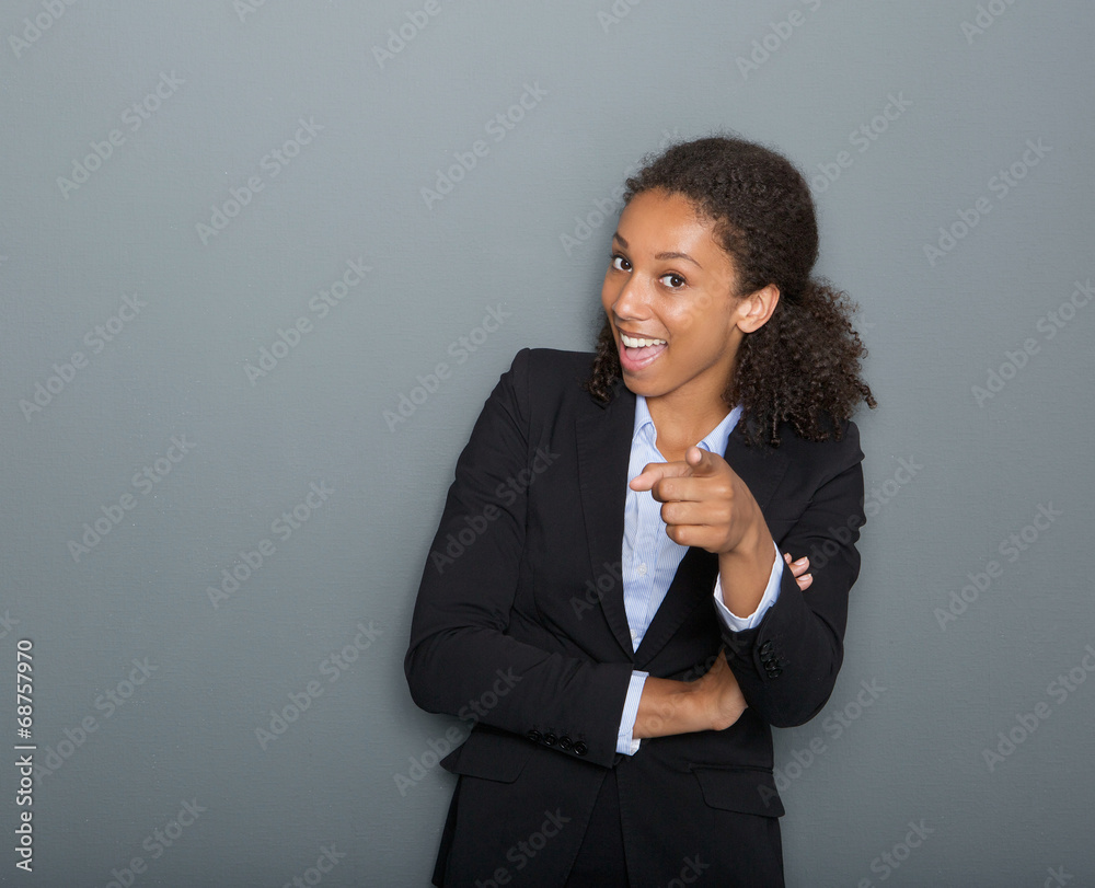 Young business woman pointing finger at you