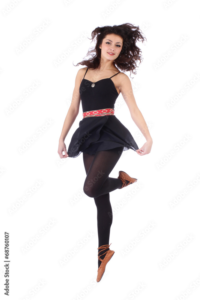 Beautiful folk dancer jumping on white background Beautiful folk dancer jumping on white background