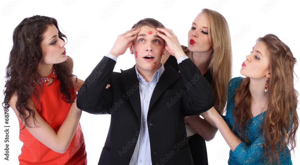 Young man with three girls and lipstick kiss-marks Young man with three girls and lipstick kiss-marks