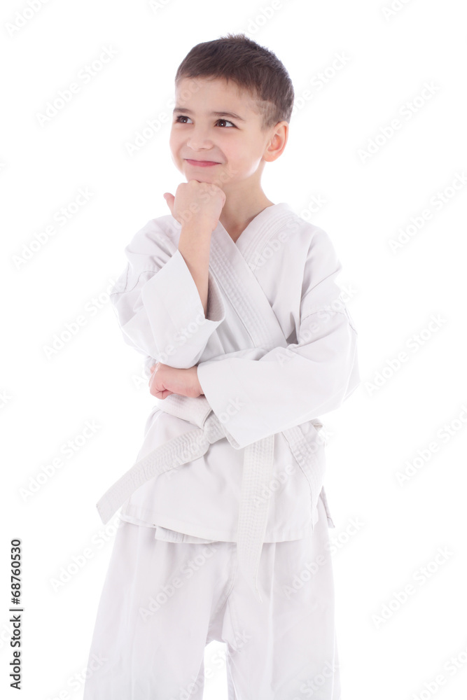 Young boy fighter in kimono with hand under the chin thinking is Young boy fighter in kimono with hand under the chin thinking is