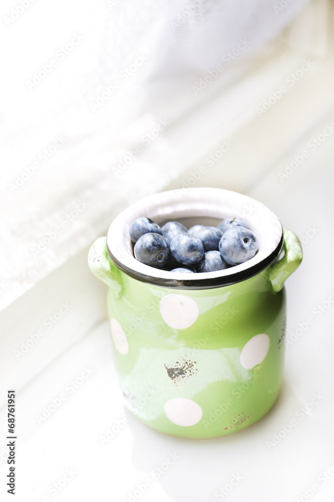 Fresh blueberries on window sill Fresh blueberries on window sill