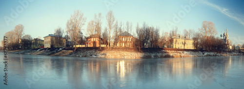 frozen river shore small town #68763977