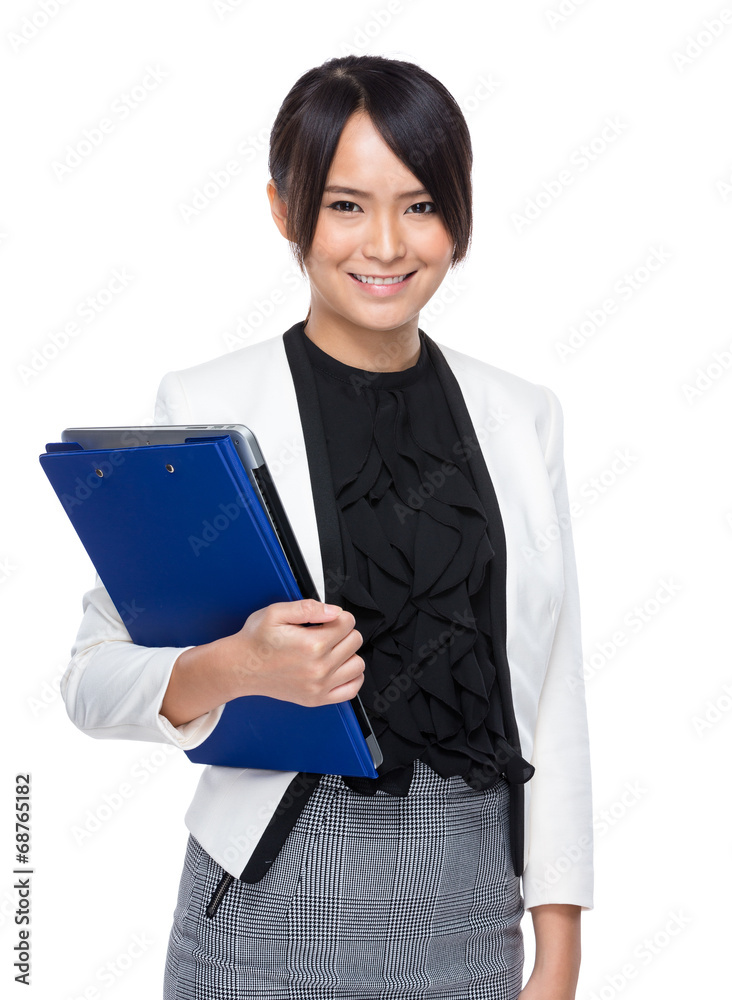 Young business woman hold laptop computer and clipboard
