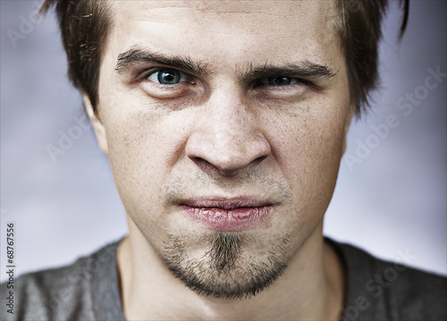 Man with aggressive look photo