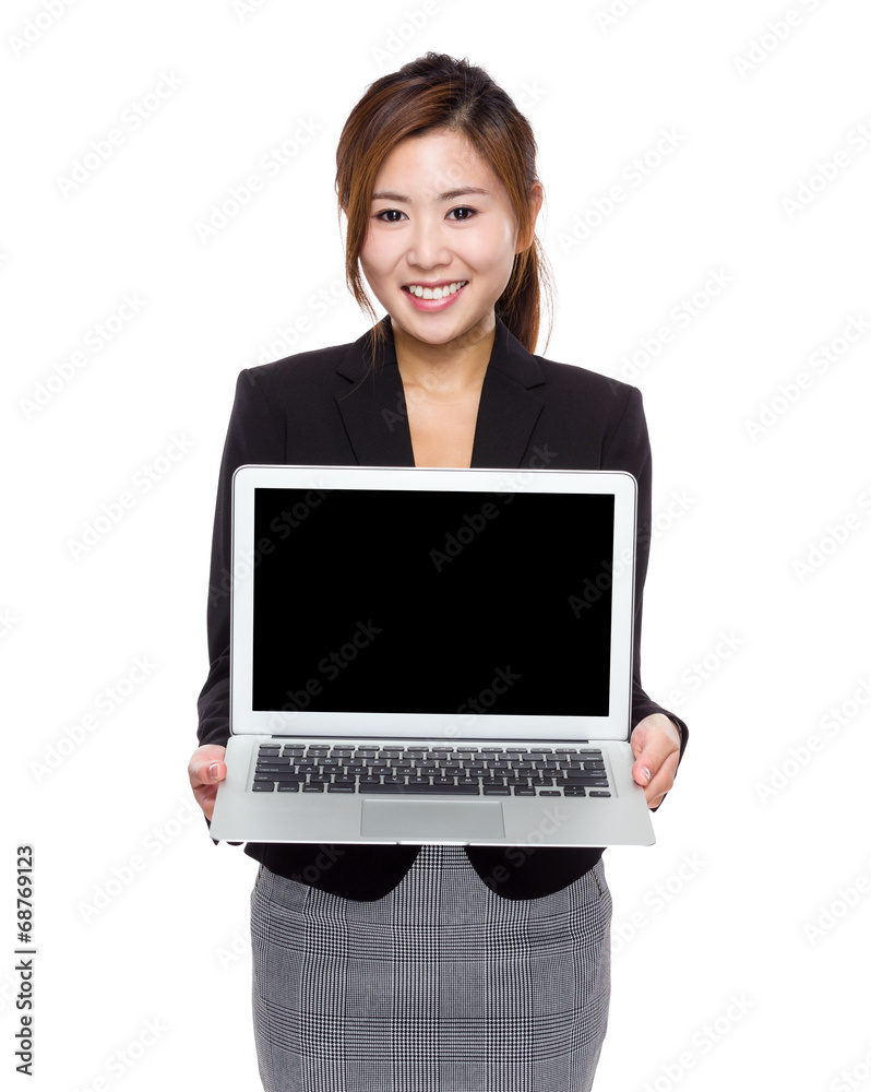Businesswoman show with blank screen of laptop computer Businesswoman show with blank screen of laptop computer