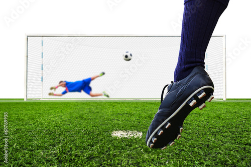 foot shooting soccer ball to goal, penalty