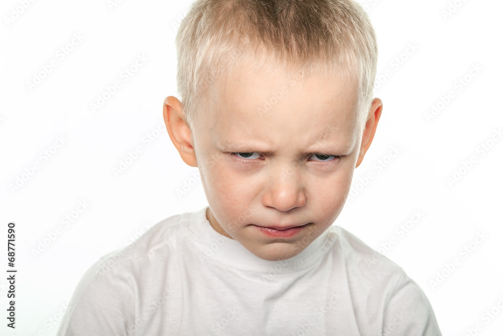 Boy with frowning face Boy with frowning face