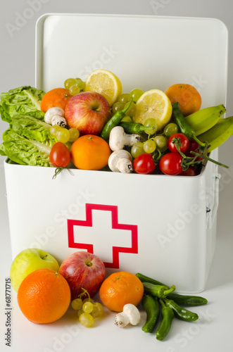 Fototapeta Naklejka Na Ścianę i Meble -  Healthy food. First aid box filled with fruits and vegetables.