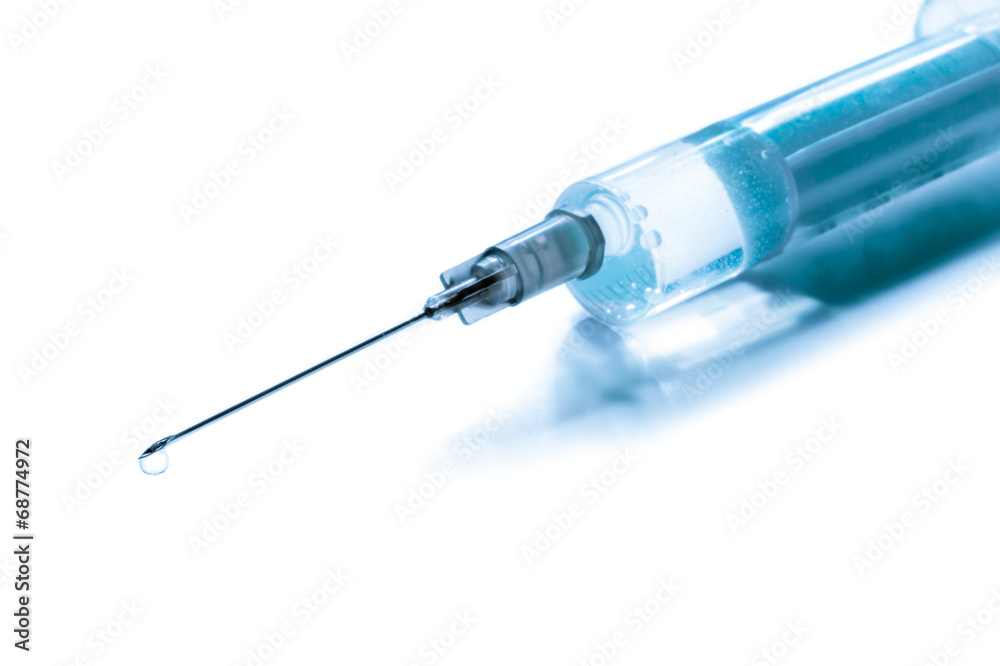 Syringe filled with vaccine isolated on a white background Syringe filled with vaccine isolated on a white background