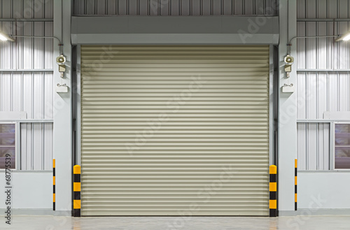 Roller door or roller shutter. Also called security door or security shutter with automatic system. For protection residential and commercial building i.e. house, warehouse, factory, shop and store.