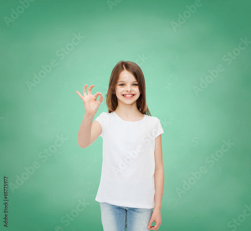 smiling little girl in white blank t-shirt © Syda Productions