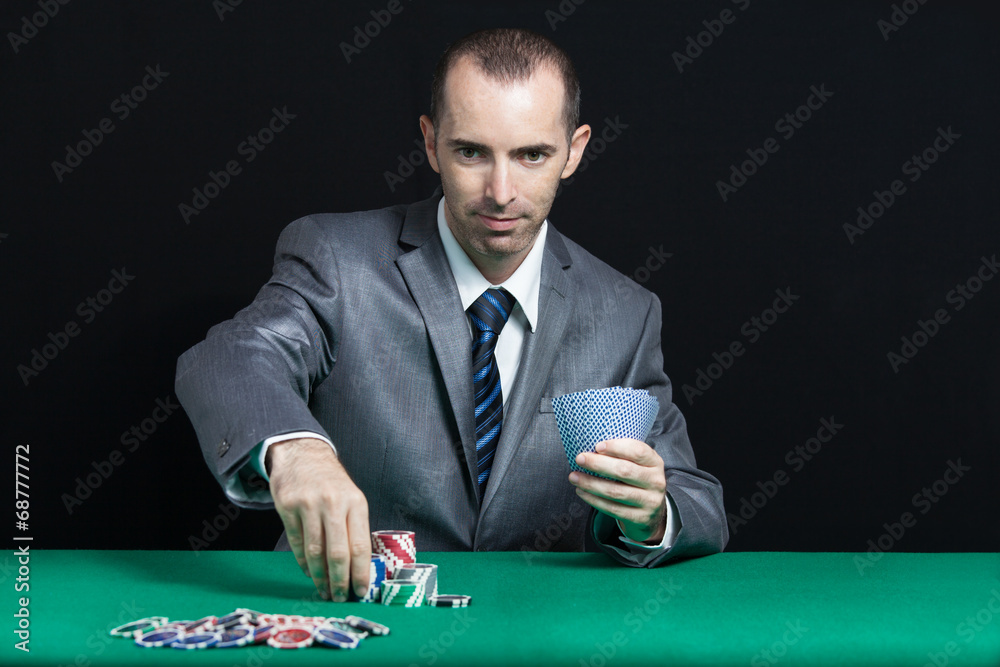 Blackjack In A Casino, A Man Makes A Bet, And Puts A Chip Blackjack In A Casino, A Man Makes A Bet, And Puts A Chip