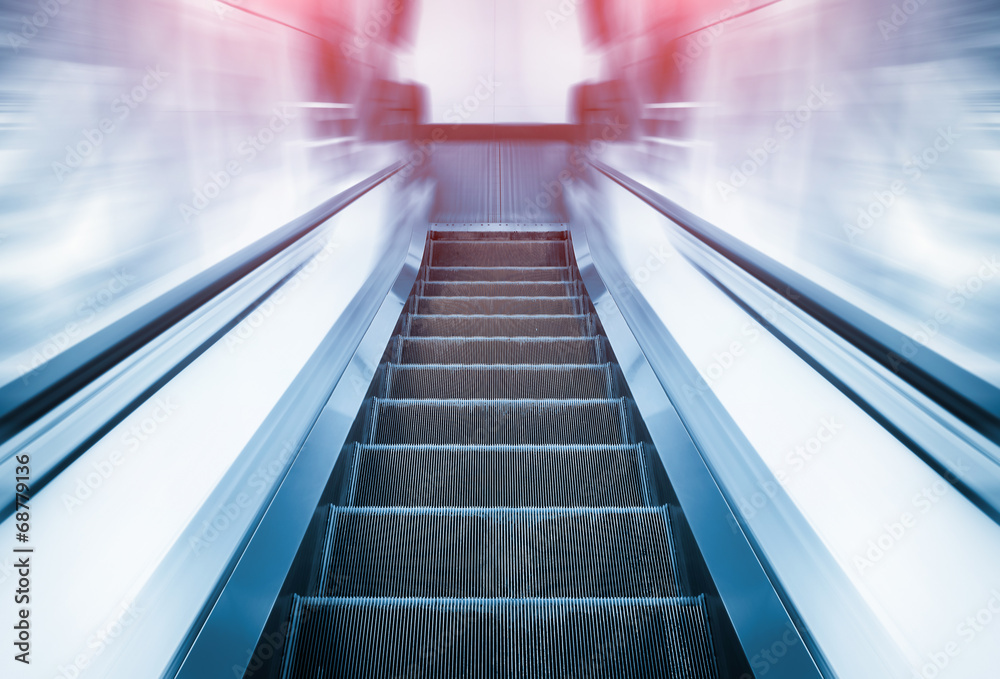 Empty escalator or moving stair. Also called stairway or staircase. Modern architecture design with step, glass for lift people up floor building i.e. shopping mall, airport, metro and subway station. Empty escalator or moving stair. Also called stairway or staircase. Modern architecture design with step, glass for lift people up floor building i.e. shopping mall, airport, metro and subway station.