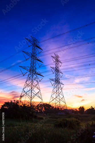 electricity high voltage power pylon at dusk