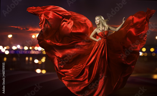 woman dancing in silk dress, artistic red blowing gown waving