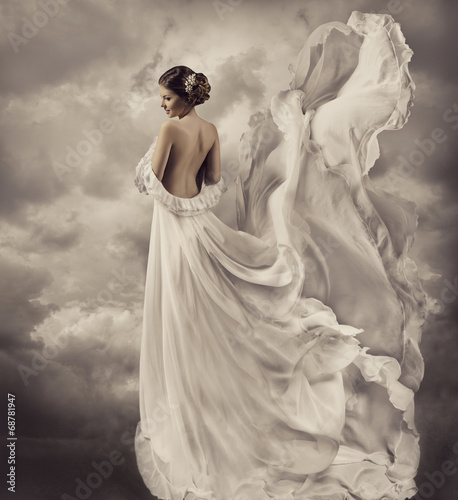woman portrait in retro dress, artistic white blowing gown