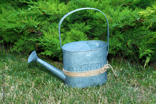 Garden tools on green grass background