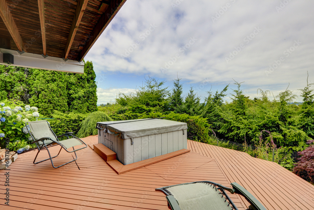 Cozy deck with jacuzzi overlooking scenic nature - obrazy, fototapety, plakaty 