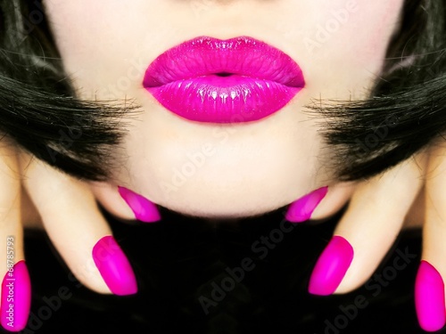 Sexy pretty woman with black hair, pink lips sending kiss smooch