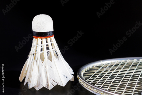 Shuttlecock and badminton on dark background © ronnarong