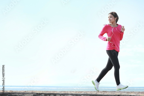 beautiful woman running on the beach