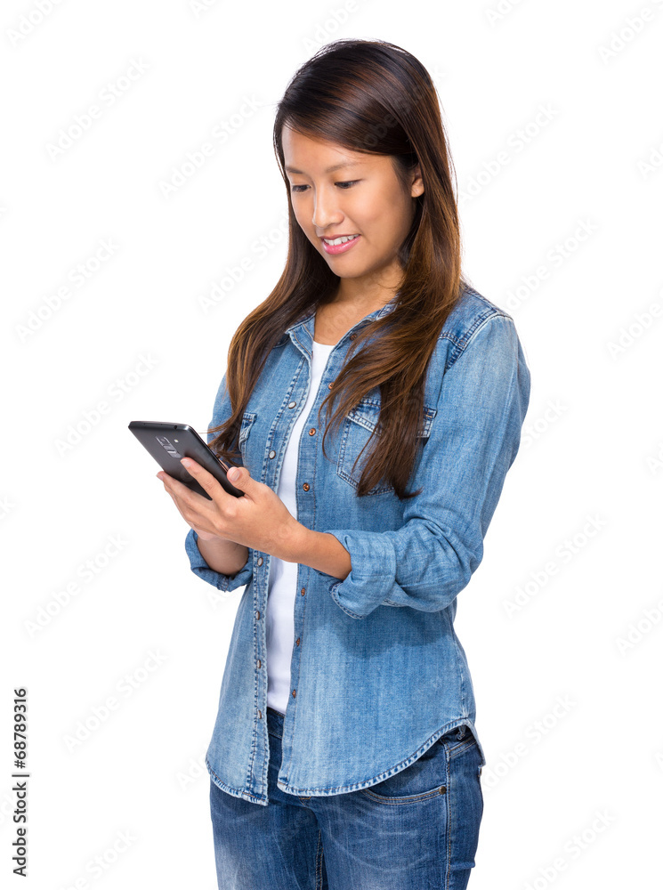 Mixed race woman red the message of cellphone Mixed race woman red the message of cellphone