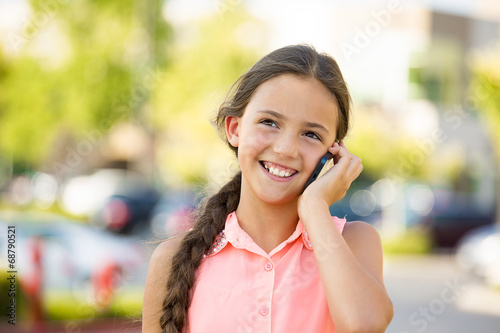 Happy girl talking on mobile, smart phone, outside background 