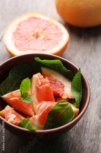 Ripe chopped grapefruit with mint leaves