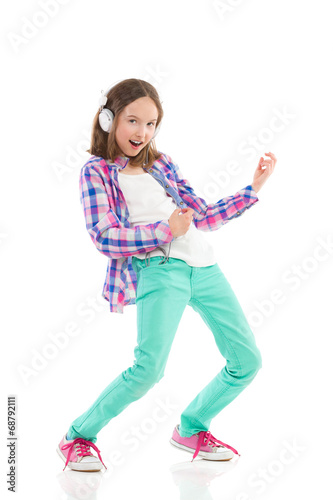 Little girl playing the air guitar