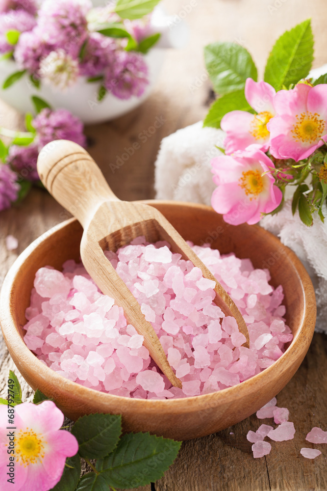 spa with pink herbal salt and wild rose flowers spa with pink herbal salt and wild rose flowers