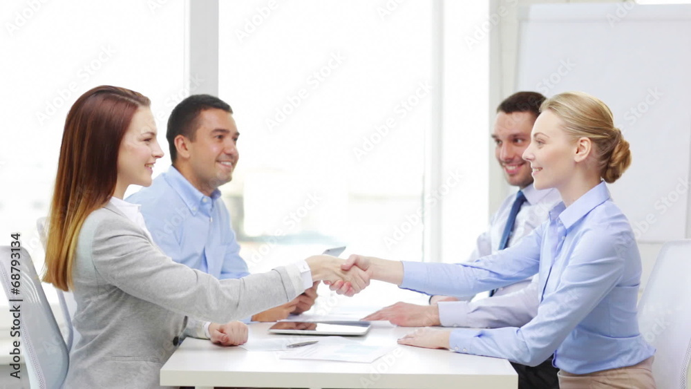 smiling team with table pc working in office smiling team with table pc working in office