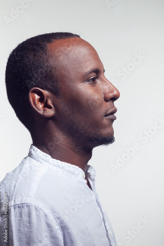 african boy with yellow linen shirt profile