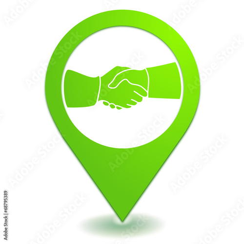 poignée de main sur symbole localisation vert