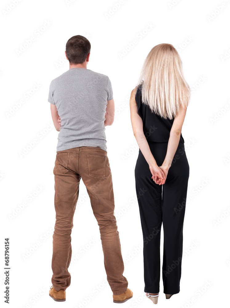 Back view of young couple hug and look into the distance.. Back view of young couple hug and look into the distance..