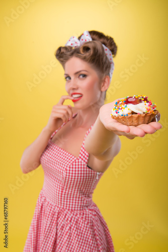 Beautiful emotional girl with pretty smile in pin-up style posin