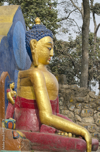 statue of Buddha at  Swayambhunath Temple in Kathmandu, Nepal. photo
