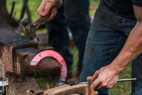 Horse shoe being made by blacksmith