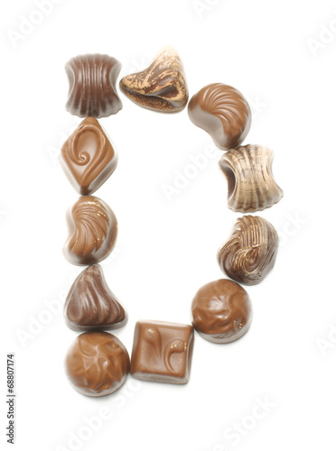 Alphabet letter D arranged from chocolate sweets isolated