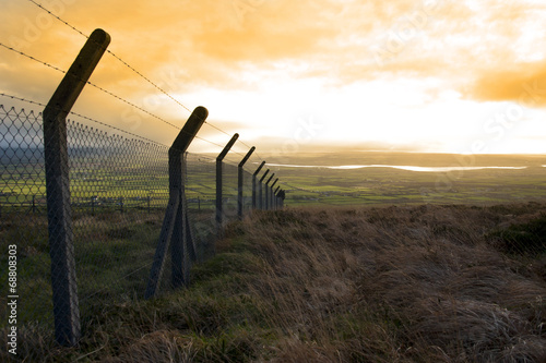 barbed wire fencing and view