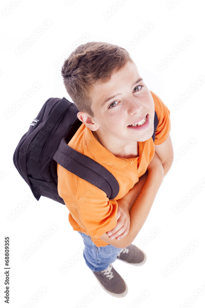 Above view of a smiling school boy with backpack, isolated on wh Above view of a smiling school boy with backpack, isolated on wh
