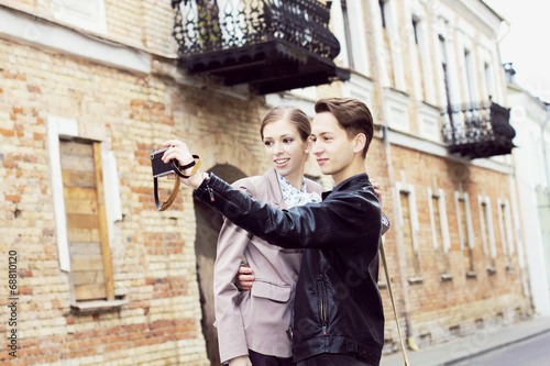 Young hipster couple photographed on the streets 