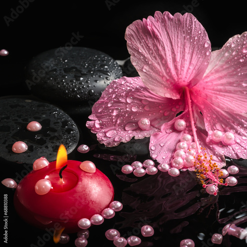 Photography Beautiful spa setting of delicate pink hibiscus, zen stones with